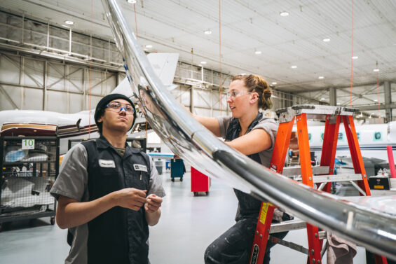 Workers repair an aircraft at Duncan Aviation in Battle Creek, Michigan