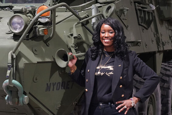 woman standing next to tank