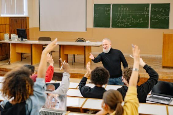Professor calls on students raising hands in class