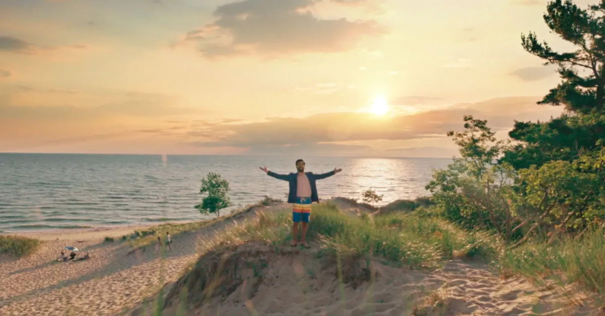 Man standing on the beach in the You Can in Michigan Ad